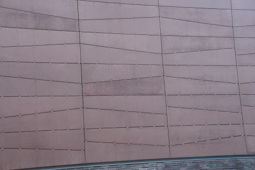 tessellation of an outer house wall in New York City by quadrilateral panels